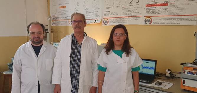 A group of people in lab coats

Description automatically generated